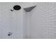 Modern shower with white subway tile and updated shower head at 4147 Grandchamp Cir, Palm Harbor, FL 34685