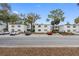 Condominium exterior showcasing multiple units, green shutters, and parking spaces across the street at 4611 W North B St # 228, Tampa, FL 33609