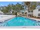 Inviting swimming pool surrounded by lush greenery, offering a refreshing outdoor experience at 4611 W North B St # 228, Tampa, FL 33609
