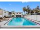 Scenic community pool surrounded by lush landscaping, offering a tranquil escape and refreshing outdoor experience at 4611 W North B St # 228, Tampa, FL 33609