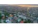 Expansive aerial view showcases waterfront homes, many with boat docks and water access, in a vibrant residential community at 4743 Spinnaker Dr, Bradenton, FL 34208