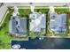 Aerial view of three homes with private docks on a canal at 4743 Spinnaker Dr, Bradenton, FL 34208