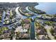 Aerial view of a waterfront community with canals and private docks at 4743 Spinnaker Dr, Bradenton, FL 34208