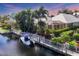 Home featuring a private dock with access to a canal at 4743 Spinnaker Dr, Bradenton, FL 34208
