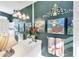 Stylish bathroom featuring colorful mermaid artwork and towels to compliment the white cabinets and sink at 4743 Spinnaker Dr, Bradenton, FL 34208