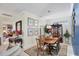 Formal dining room with dark wood furniture, art-filled walls, and a decorative area rug at 4743 Spinnaker Dr, Bradenton, FL 34208