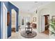 Elegant foyer featuring tile floors, arched doorways, and a round accent table at 4743 Spinnaker Dr, Bradenton, FL 34208
