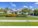 Charming home with lush landscaping, a well-manicured lawn, and a welcoming front entrance at 4743 Spinnaker Dr, Bradenton, FL 34208