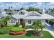 Charming single-story home with meticulously landscaped yard and a distinctive red front door at 4743 Spinnaker Dr, Bradenton, FL 34208