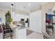 Bright kitchen features white cabinetry, granite counters, a backsplash, and stainless appliances at 4743 Spinnaker Dr, Bradenton, FL 34208