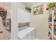 Bright laundry room featuring a stacked washer and dryer, storage cabinets, and decor at 4743 Spinnaker Dr, Bradenton, FL 34208