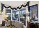 Elegant living room with sliding glass doors leading to the outdoor screened in pool at 4743 Spinnaker Dr, Bradenton, FL 34208