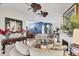 Open-concept living room featuring elegant decor, a fireplace, and plenty of natural light at 4743 Spinnaker Dr, Bradenton, FL 34208