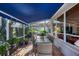 Outdoor patio with a dining table and a grill, perfect for al fresco dining and entertaining guests at 4743 Spinnaker Dr, Bradenton, FL 34208
