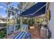 Covered patio with comfortable seating, a dining area, and scenic waterfront views at 4743 Spinnaker Dr, Bradenton, FL 34208