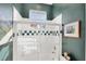 Bright shower and tub with glass door and colorful tiles at 4743 Spinnaker Dr, Bradenton, FL 34208