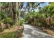 Community walking trail through lush, tropical landscaping at 4743 Spinnaker Dr, Bradenton, FL 34208
