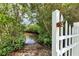 Community water access point through a white picket gate at 4743 Spinnaker Dr, Bradenton, FL 34208