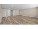 Spacious basement featuring new vinyl plank flooring and freshly painted walls at 561 Golf And Sea Blvd, Apollo Beach, FL 33572