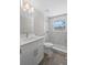 Renovated bathroom with marble tile shower, modern fixtures, and natural light at 561 Golf And Sea Blvd, Apollo Beach, FL 33572