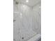 Stylish walk-in shower featuring modern fixtures, marble-style tile, and a mosaic tile shower floor at 561 Golf And Sea Blvd, Apollo Beach, FL 33572