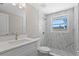 Modern bathroom with marble tile shower and white vanity at 561 Golf And Sea Blvd, Apollo Beach, FL 33572