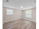 Bedroom with wood floor, neutral walls, and window views at 561 Golf And Sea Blvd, Apollo Beach, FL 33572