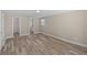 Bright bedroom with new vinyl plank flooring, updated paint, closet, and access to en-suite bathroom at 561 Golf And Sea Blvd, Apollo Beach, FL 33572