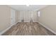 Inviting bedroom with new floors, fresh paint, and access to closet and modern en-suite bathroom at 561 Golf And Sea Blvd, Apollo Beach, FL 33572