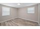Bedroom with wood flooring, neutral walls, and ample natural light at 561 Golf And Sea Blvd, Apollo Beach, FL 33572