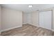 Bedroom featuring wood flooring, closet, and neutral color scheme at 561 Golf And Sea Blvd, Apollo Beach, FL 33572