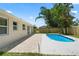 Backyard featuring a refreshing swimming pool and brick patio area at 561 Golf And Sea Blvd, Apollo Beach, FL 33572