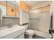 Bathroom with a white vanity, toilet, and glass-enclosed shower at 5623 80Th N St # 415, St Petersburg, FL 33709