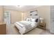 Stylishly decorated bedroom with a large bed and soothing color palette at 5623 80Th N St # 415, St Petersburg, FL 33709