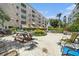 Community outdoor space featuring multiple seating areas and lush greenery at 5623 80Th N St # 415, St Petersburg, FL 33709