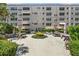 Inviting courtyard featuring picnic tables, greenery and mature trees at 5623 80Th N St # 415, St Petersburg, FL 33709