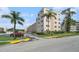 Inviting exterior view of building, showcasing a lush green landscape and convenient parking at 5623 80Th N St # 415, St Petersburg, FL 33709