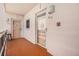 Hallway with doors numbered 415 and 416 and an orange floor at 5623 80Th N St # 415, St Petersburg, FL 33709
