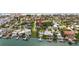 Sweeping aerial view of the property's location in a coastal neighborhood with waterfront access at 58 Aster St, Clearwater Beach, FL 33767