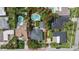 A captivating aerial view showcases this home and its large yard, complete with a pool and patio at 58 Aster St, Clearwater Beach, FL 33767