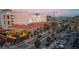 Aerial view showing the lively cityscape, street-level activity, and mixed-use buildings in the area at 58 Aster St, Clearwater Beach, FL 33767