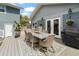 Spacious backyard deck with outdoor seating and a dining area perfect for entertaining at 58 Aster St, Clearwater Beach, FL 33767