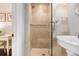 Elegant bathroom with walk-in shower, glass door, and modern fixtures at 58 Aster St, Clearwater Beach, FL 33767
