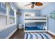 Coastal-themed bedroom with bunk beds and natural light at 58 Aster St, Clearwater Beach, FL 33767