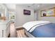 Bright bedroom with hardwood floors, a dresser, and lots of natural light at 58 Aster St, Clearwater Beach, FL 33767