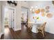 Cozy breakfast nook with decorative wall and dining set, conveniently located off the kitchen at 58 Aster St, Clearwater Beach, FL 33767