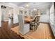 Stylish dining room showcasing a wood table, comfortable seating, and bright lighting at 58 Aster St, Clearwater Beach, FL 33767