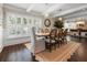 Dining room features a large wood table, ample natural light, and hardwood floors at 58 Aster St, Clearwater Beach, FL 33767