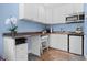 Convenient kitchenette area with sleek countertops, microwave, mini fridge, and ample cabinet space at 58 Aster St, Clearwater Beach, FL 33767