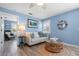 Relaxing living room area with a comfortable sofa, stylish decor, and plenty of natural light at 58 Aster St, Clearwater Beach, FL 33767